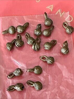 Seventeen handmade dark brass beads 
 holes st the top great for making jewelry